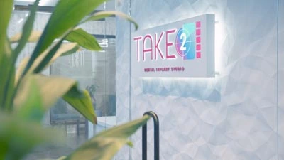 Take 2 Dental Implant Studio sign 