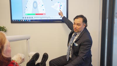 Dr. Burk showing a patient their dental x-rays