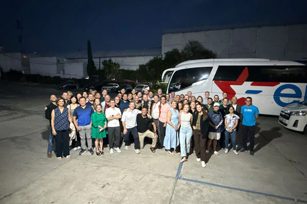Large group of implant course attendees outdoors at night